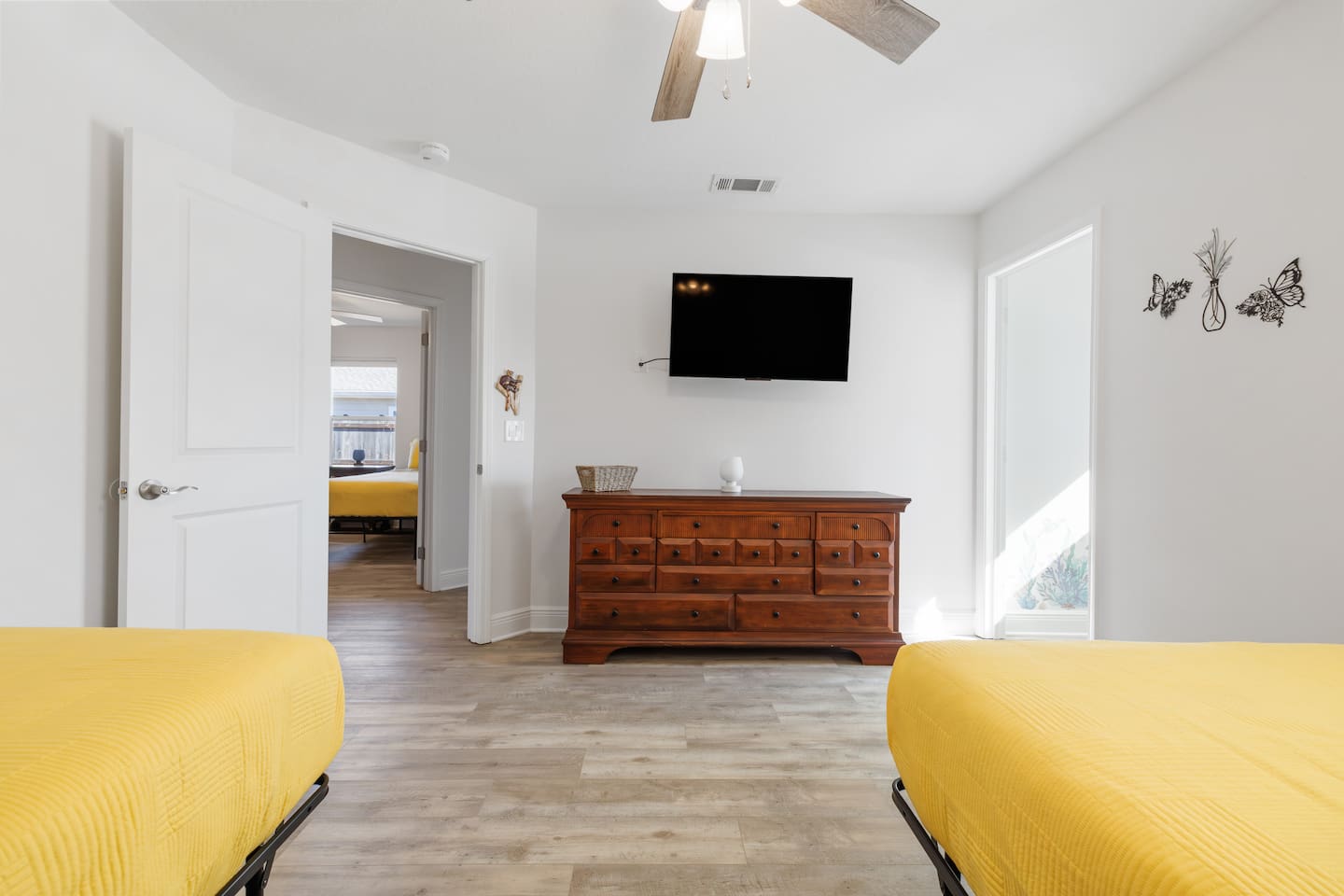 The second bedroom with a 43-inch Roku TV, and you can see the dedicated kid's playroom to the right.  Roku TVs allow you to view your own streaming shows and will log you out automatically when you leave.
