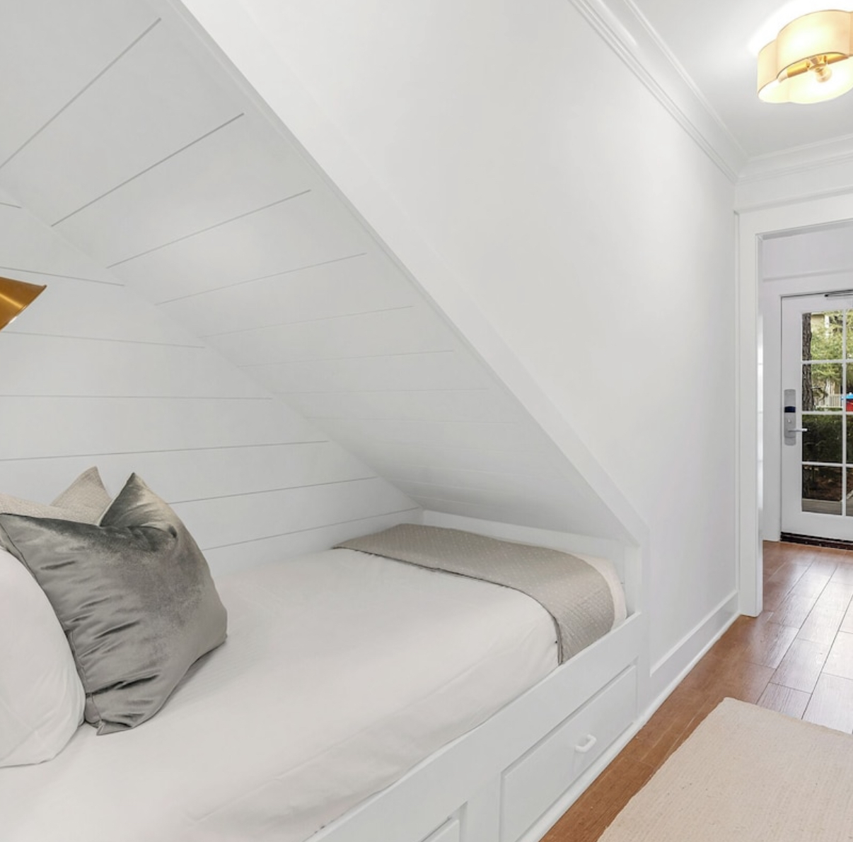 The cutest twin bed with storage in the hallway