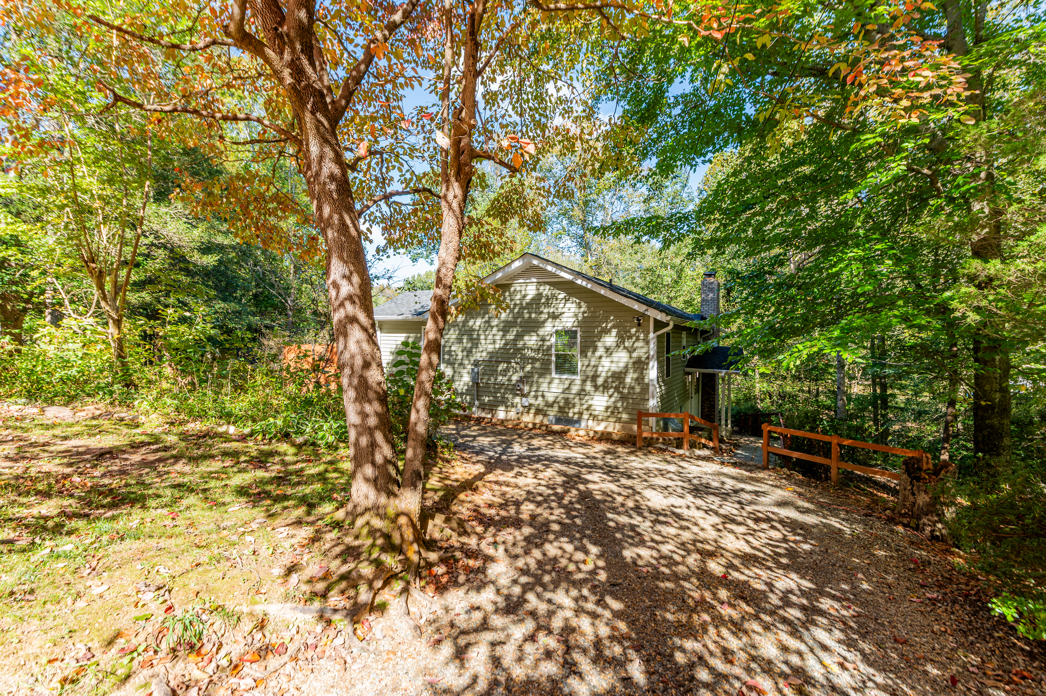 Exterior: Embrace tranquility in this nature-surrounded haven with vibrant foliage!