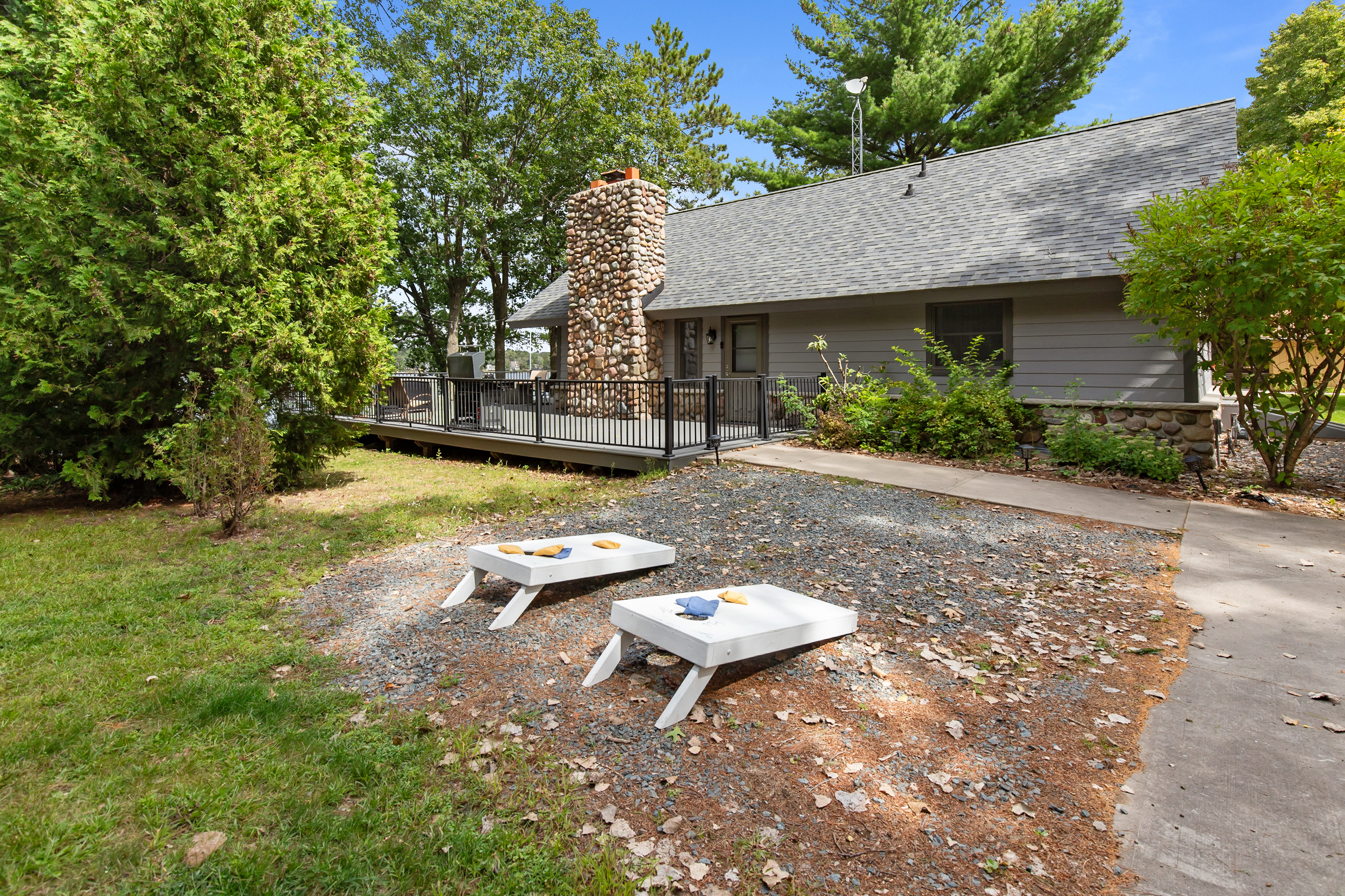 Challenge friends and family to a game of cornhole—perfect for laid-back afternoons by the lake