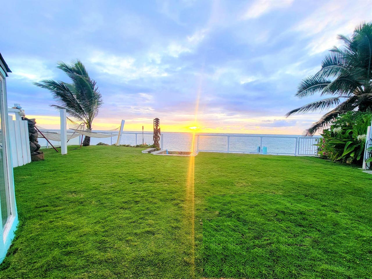 Sunrise in the Garden of Eden at the home with the worlds softest grass that is a Japanese hybrid Emerald Zoysia grass.