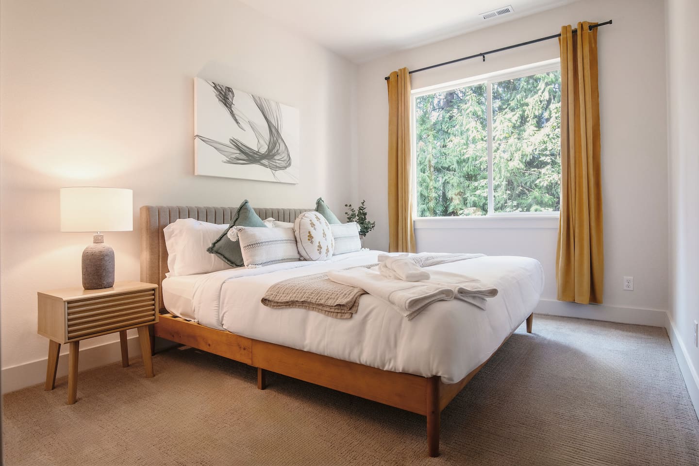 This is one of the three bedrooms downstairs, featuring a medium-firm king mattress bed.