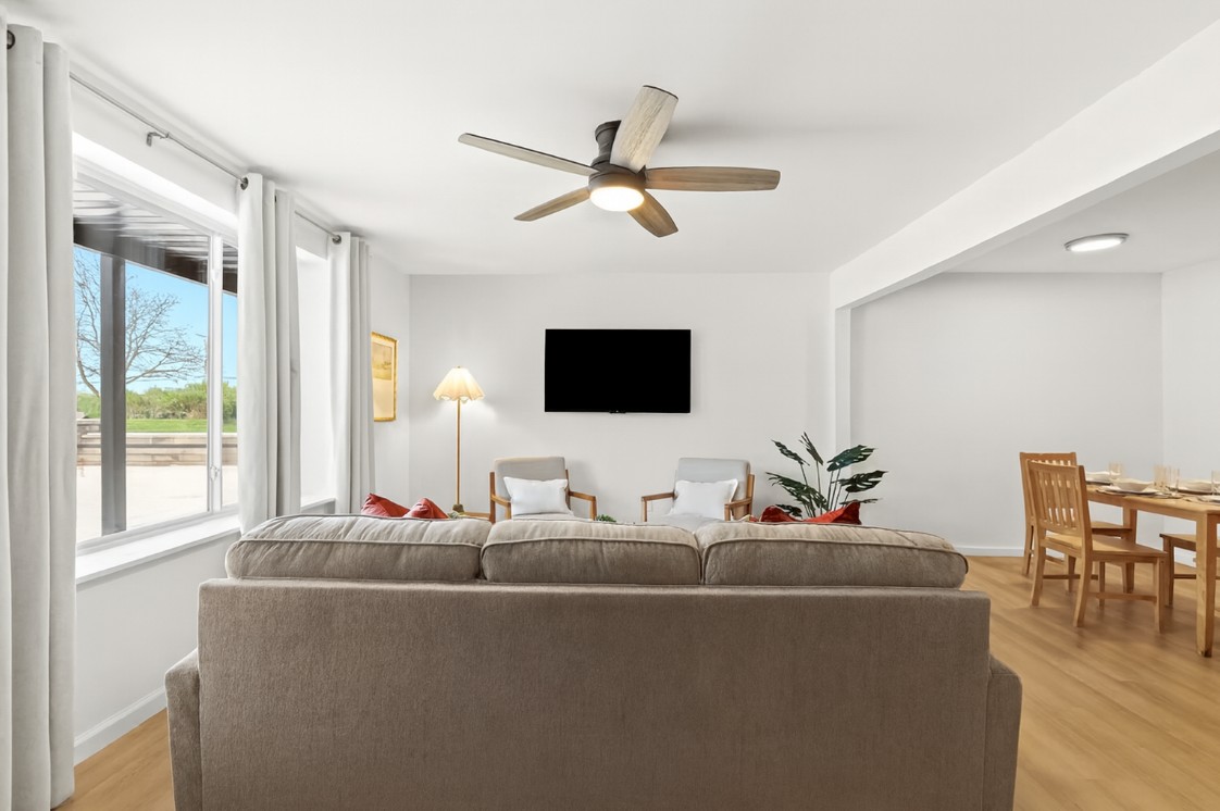 Stream your favorite content from the comfort of the couch—just steps from the dining and kitchen areas.