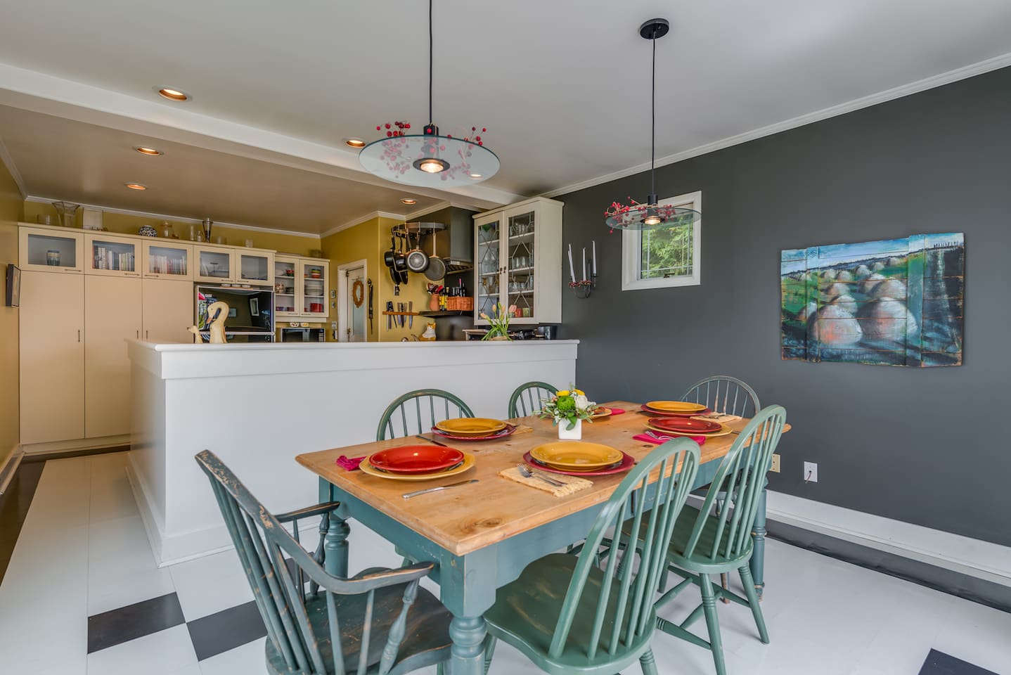 The dining area adjacent to the kitchen.   Open and friendly- great for conversation as meals are being prepared or drinks are being served!