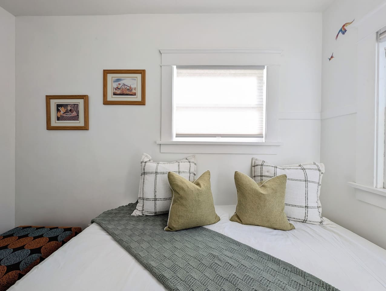 Cozy bonus room with twin bed, soft natural light, and a peaceful atmosphere.