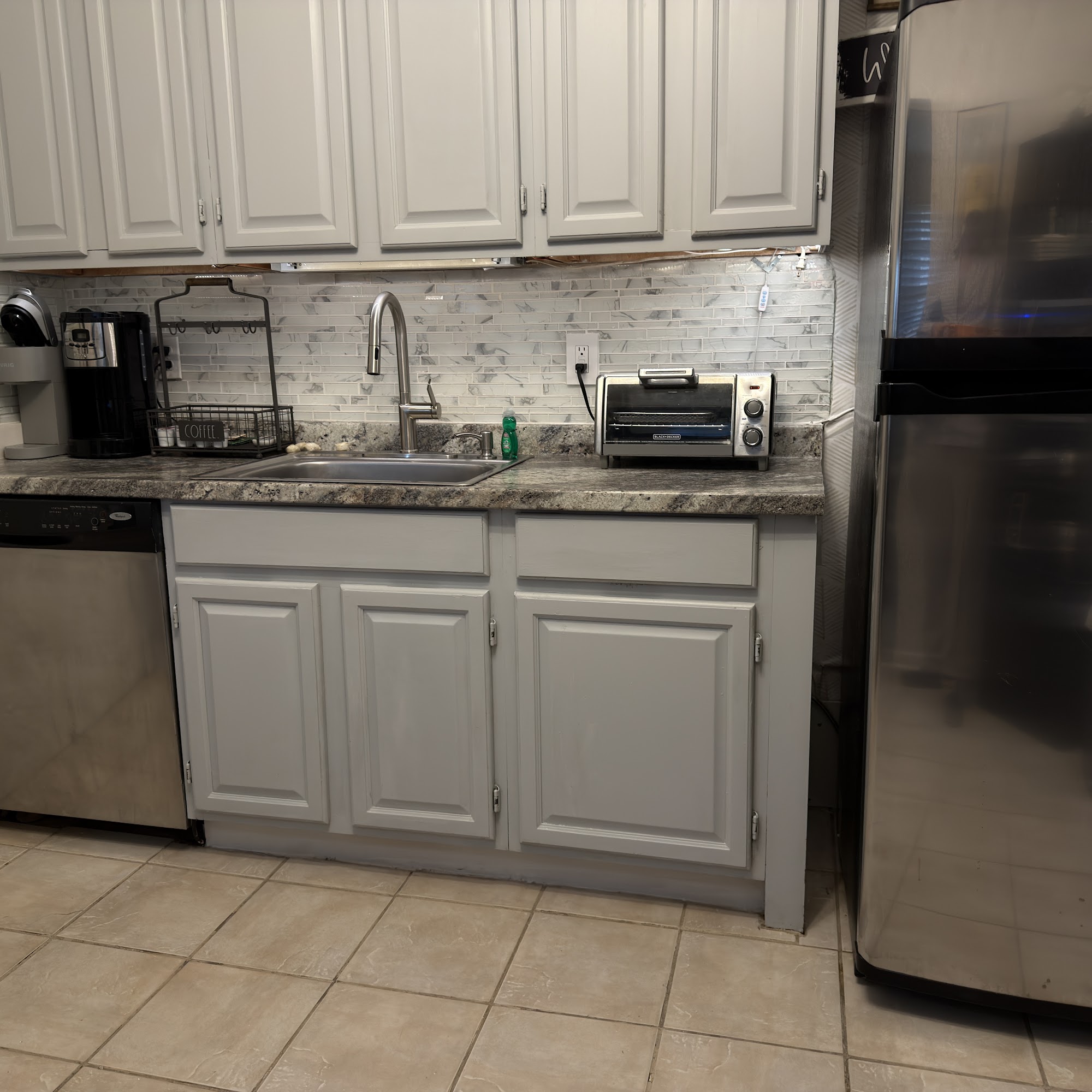 Kitchen with dishwasher, stainless refrigerator and coffee station