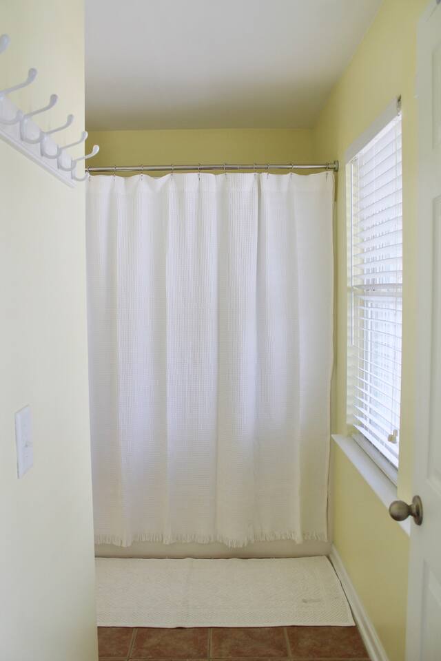 3rd floor bathroom. Shower/tub. Plenty of hooks to hand wet clothes/towels. 