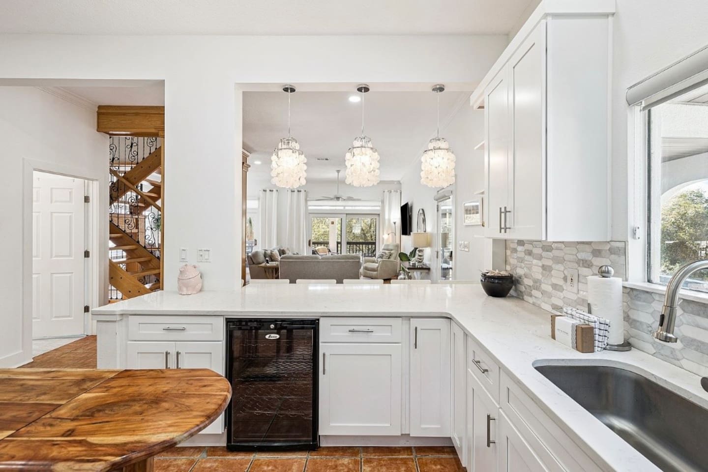 Modern kitchen setup designed for convenience, complete with a built-in wine cooler