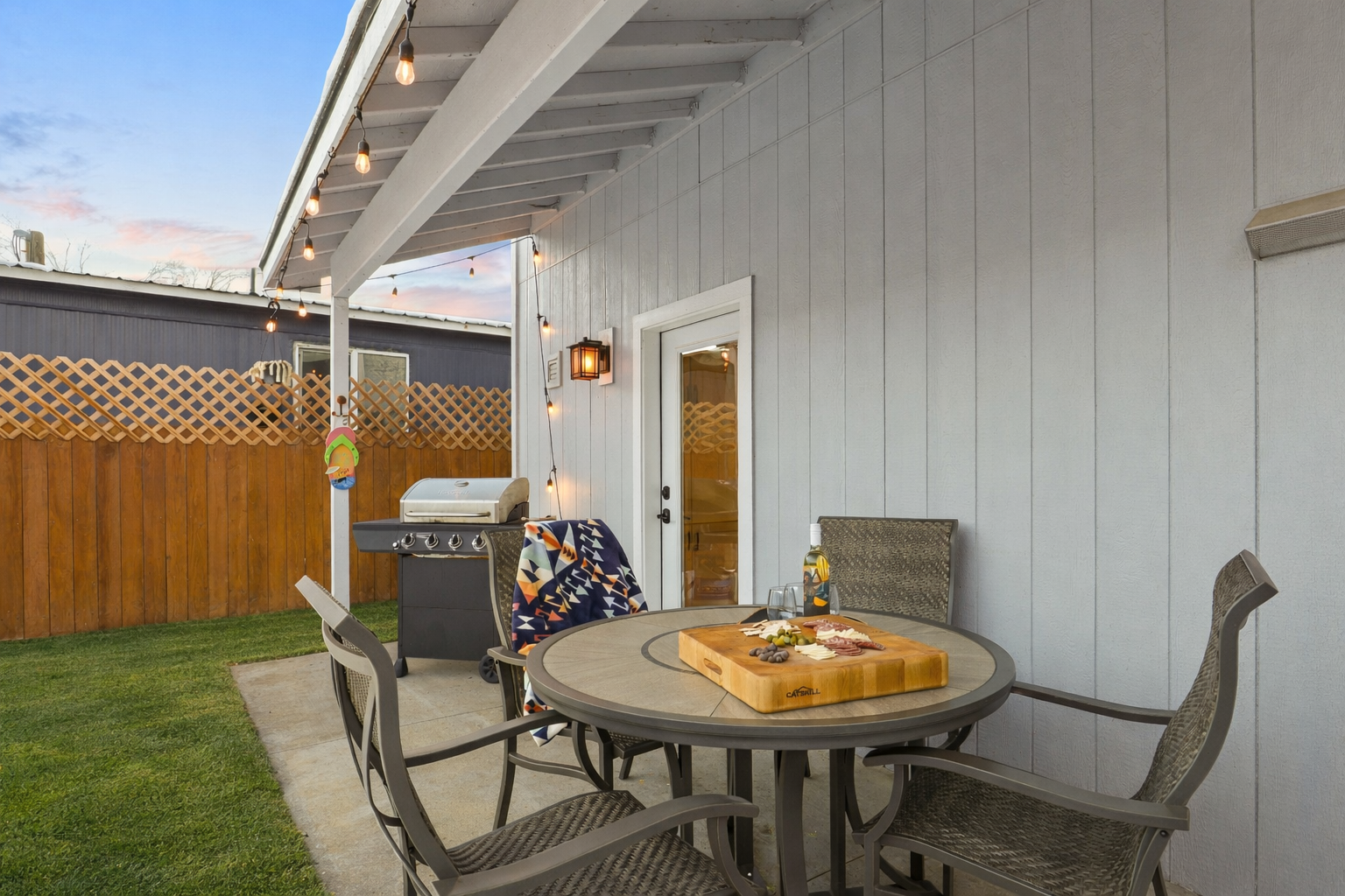 Backyard with covered outdoor dining and BBQ, propane provided