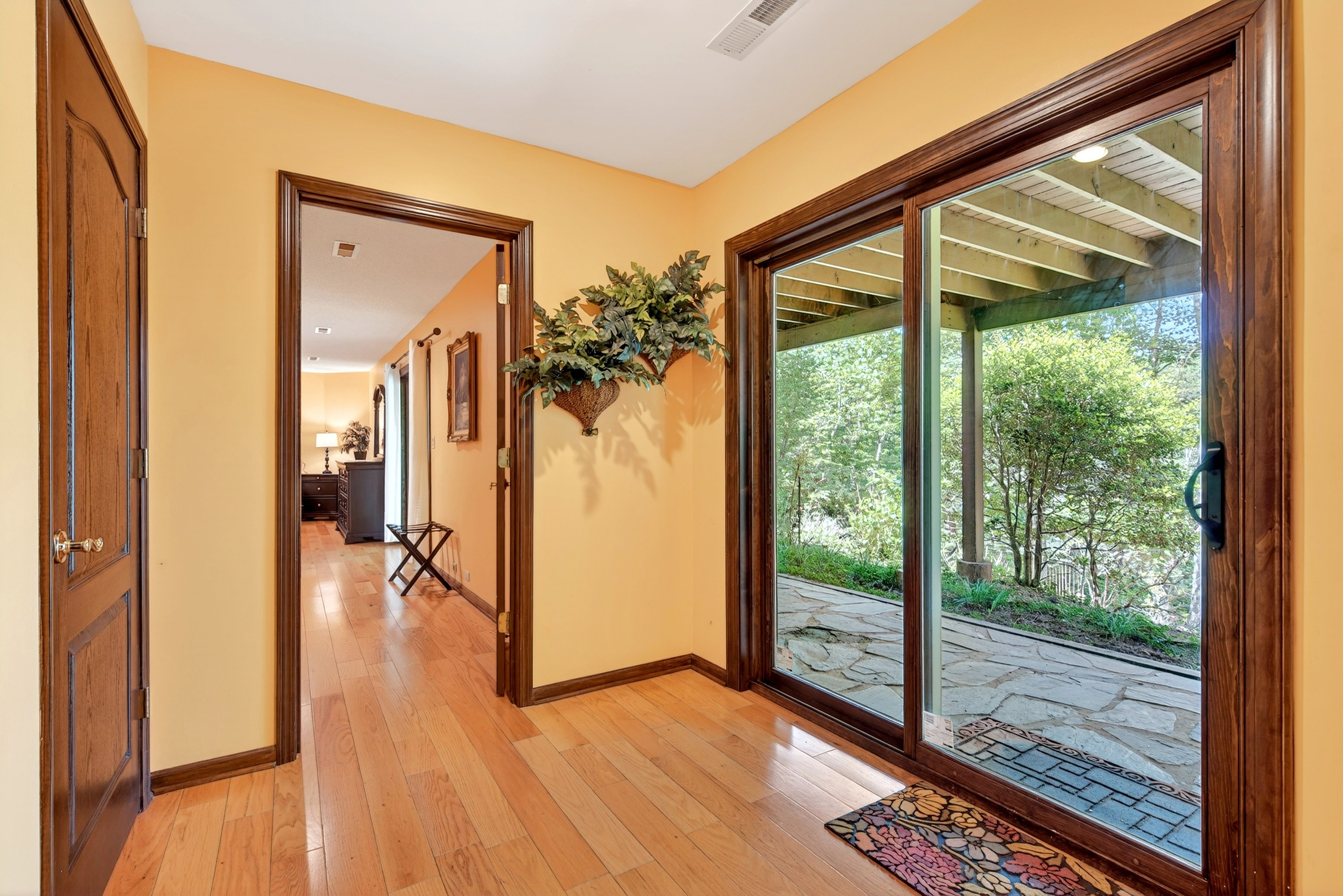 Lower level hallway that has easy access to the back yard