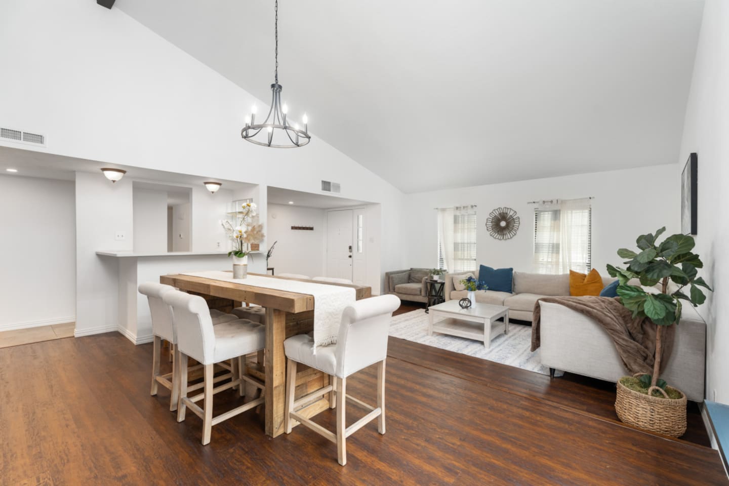Bright open-concept living + dining area, perfect for gathering with family and friends.