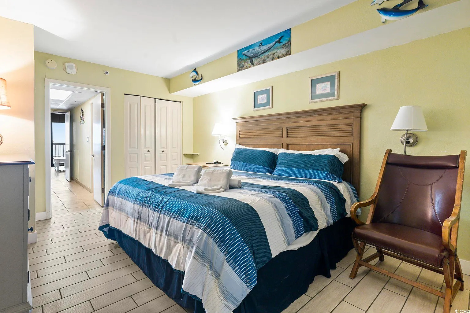 Relax in comfort with soft linens and a calm coastal vibe