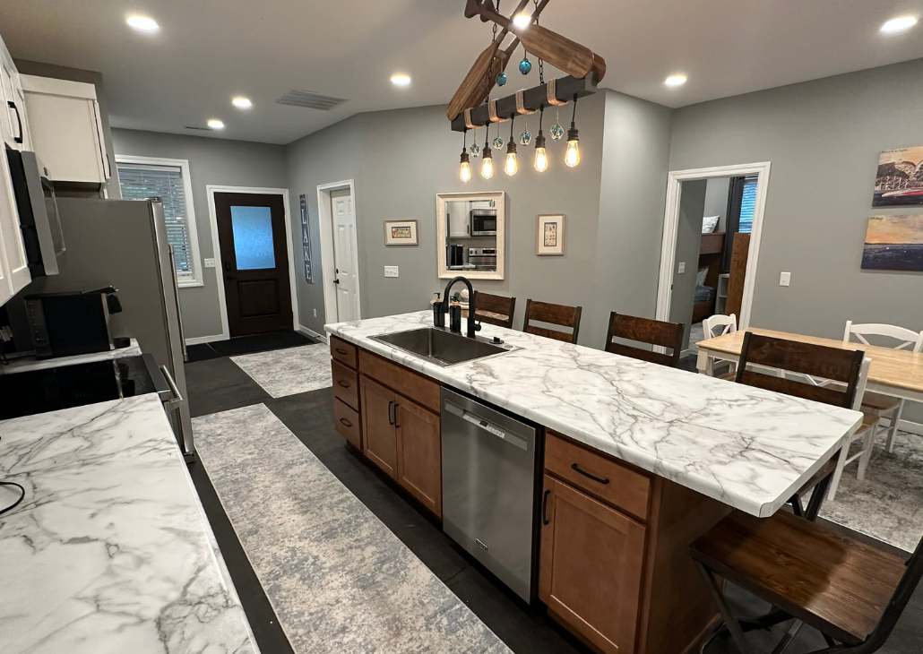 NEW HOUSE: View from kitchen to the front door and the door that goes into the garage.