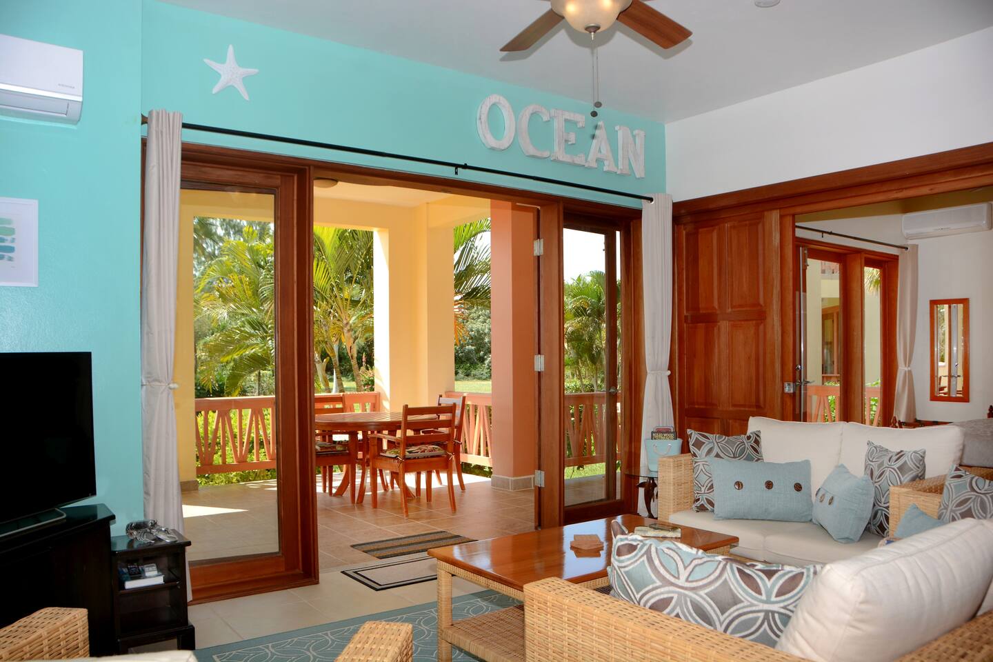 Living room with doors open to balcony