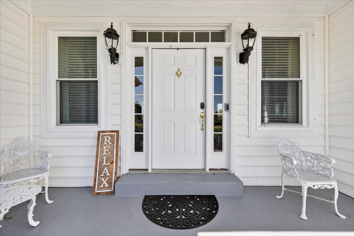 Welcoming entry with cozy spots to sit and relax.