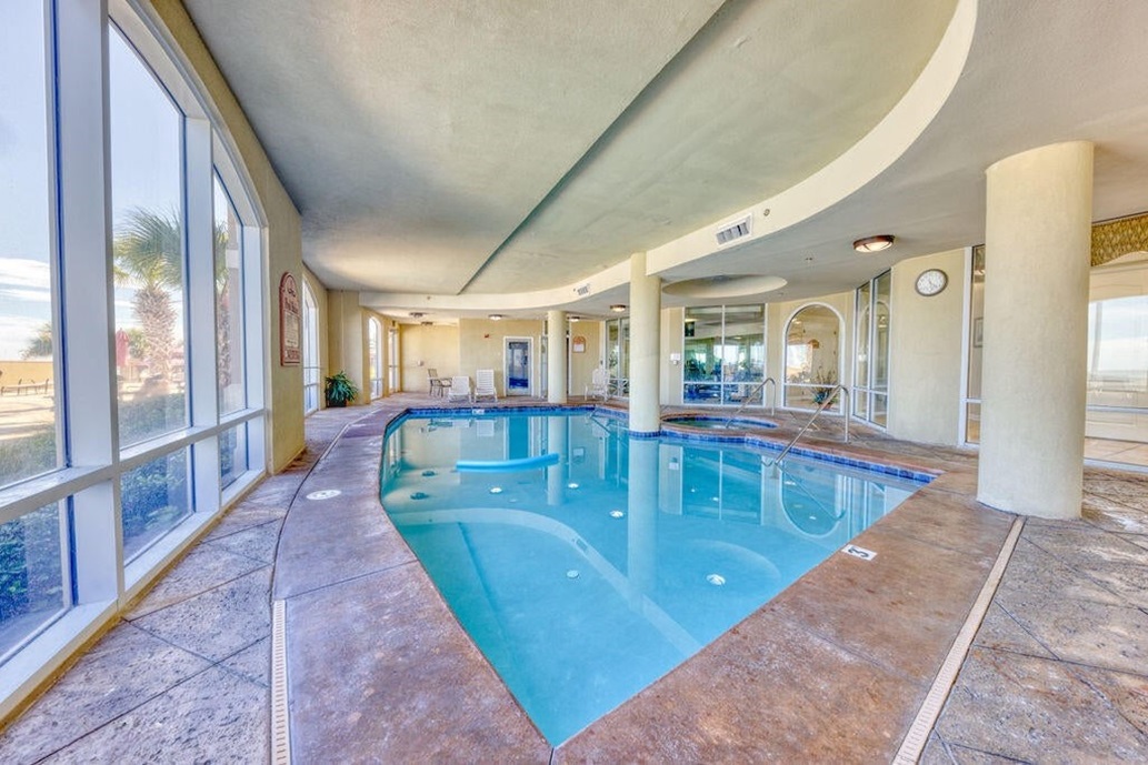 Indoor pool, hot tub, sauna, window to fitness room.