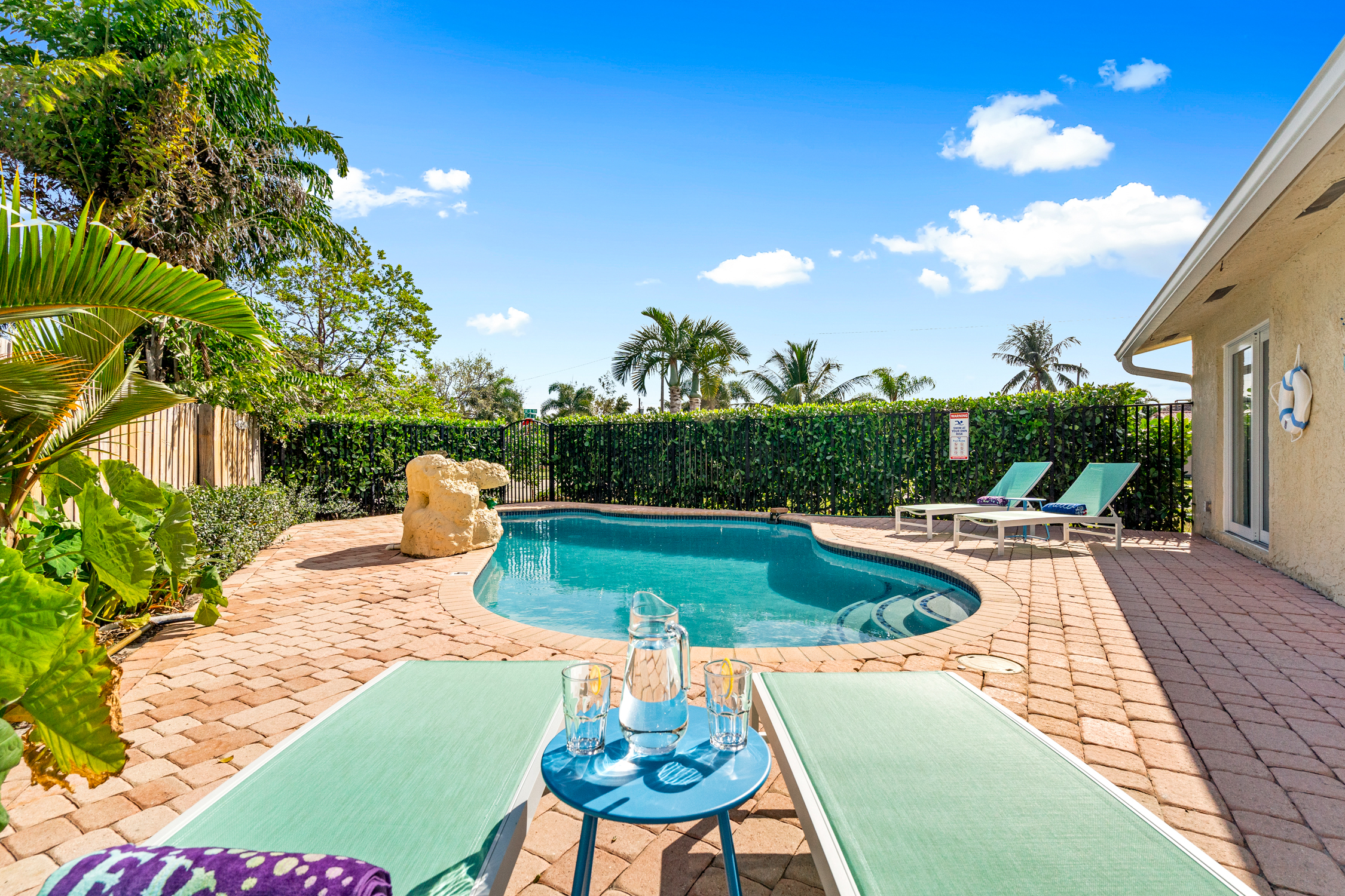 Amazing heated private pool with water fountain and loungers. Fence will provide full privacy for total relaxation.