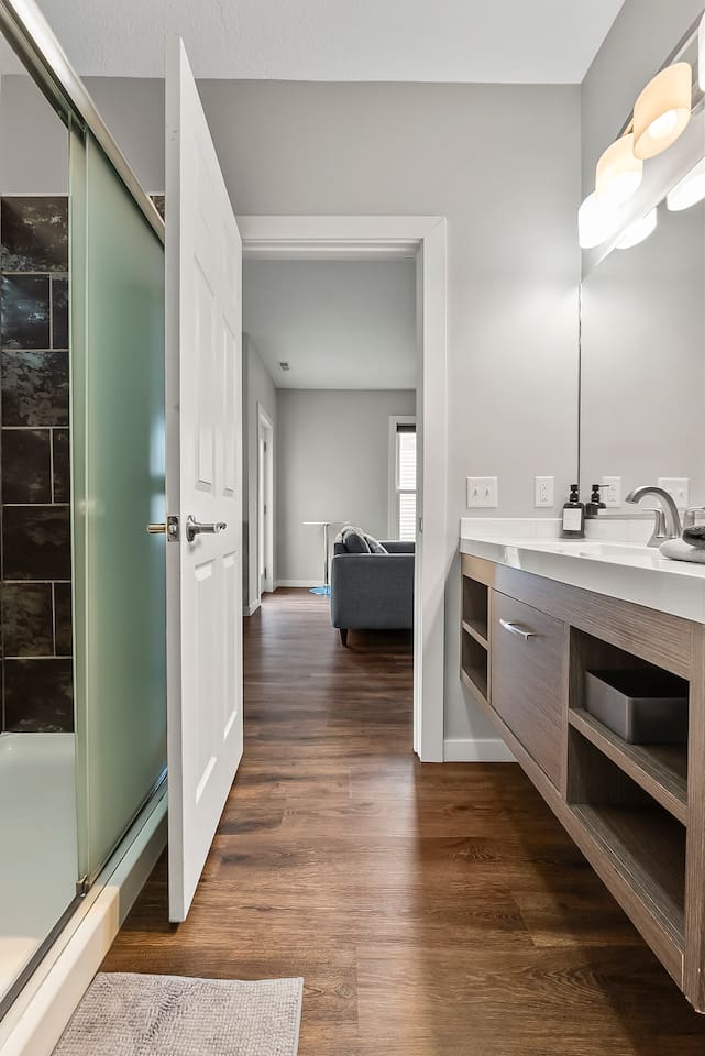 Bathroom opens seamlessly to the living area, combining function and style.