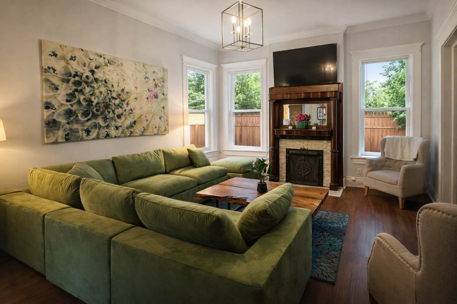 Living Room with Velvet Large Section Sofa and addition side chairs. 55" LED Smart TV.