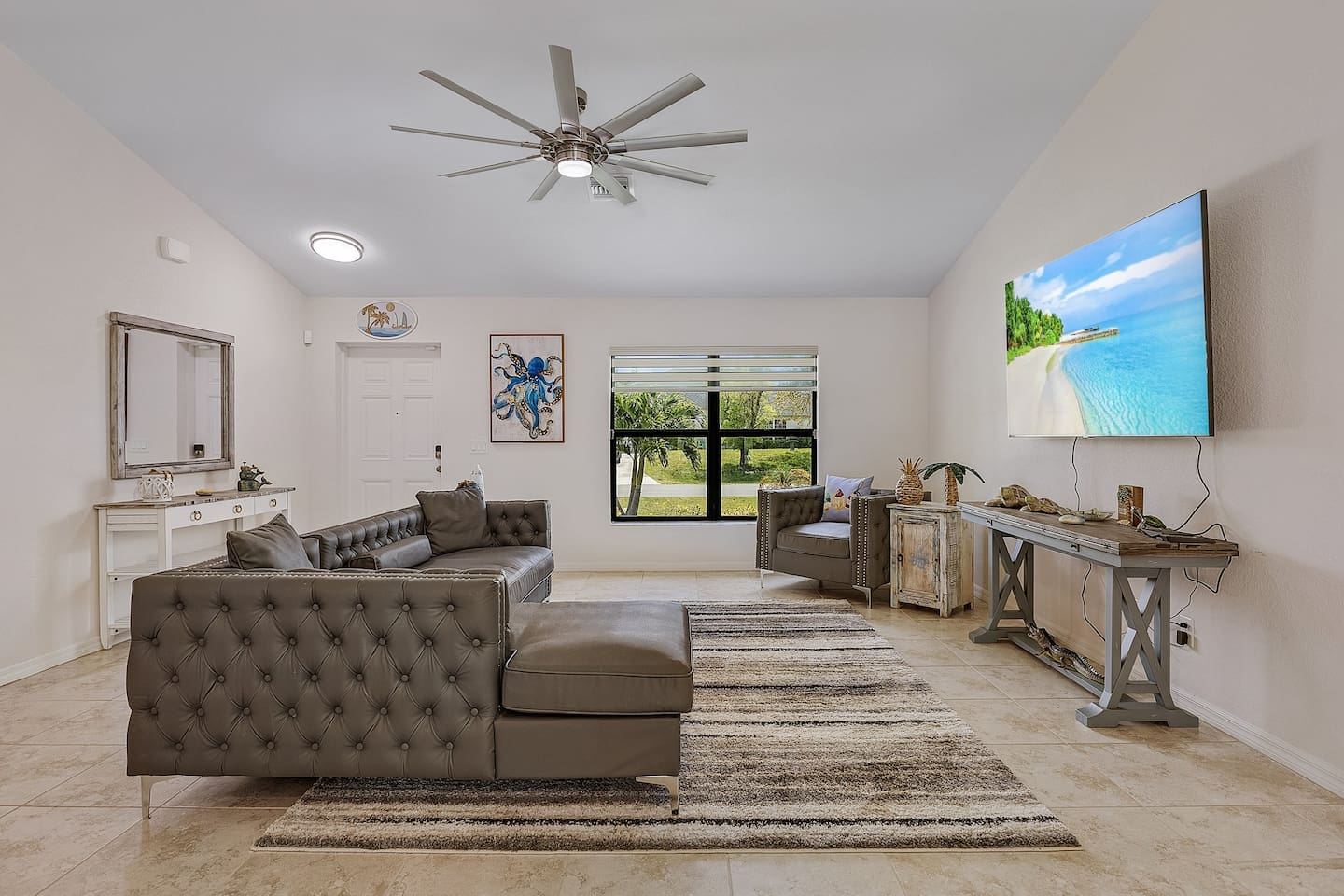 Spacious living area with cozy seating, ideal for movie nights.