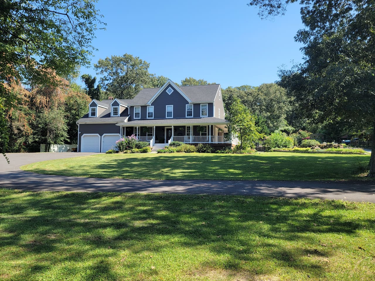 Front of House (4,125 Sq ft) with wrap around porch on 1 acre lot