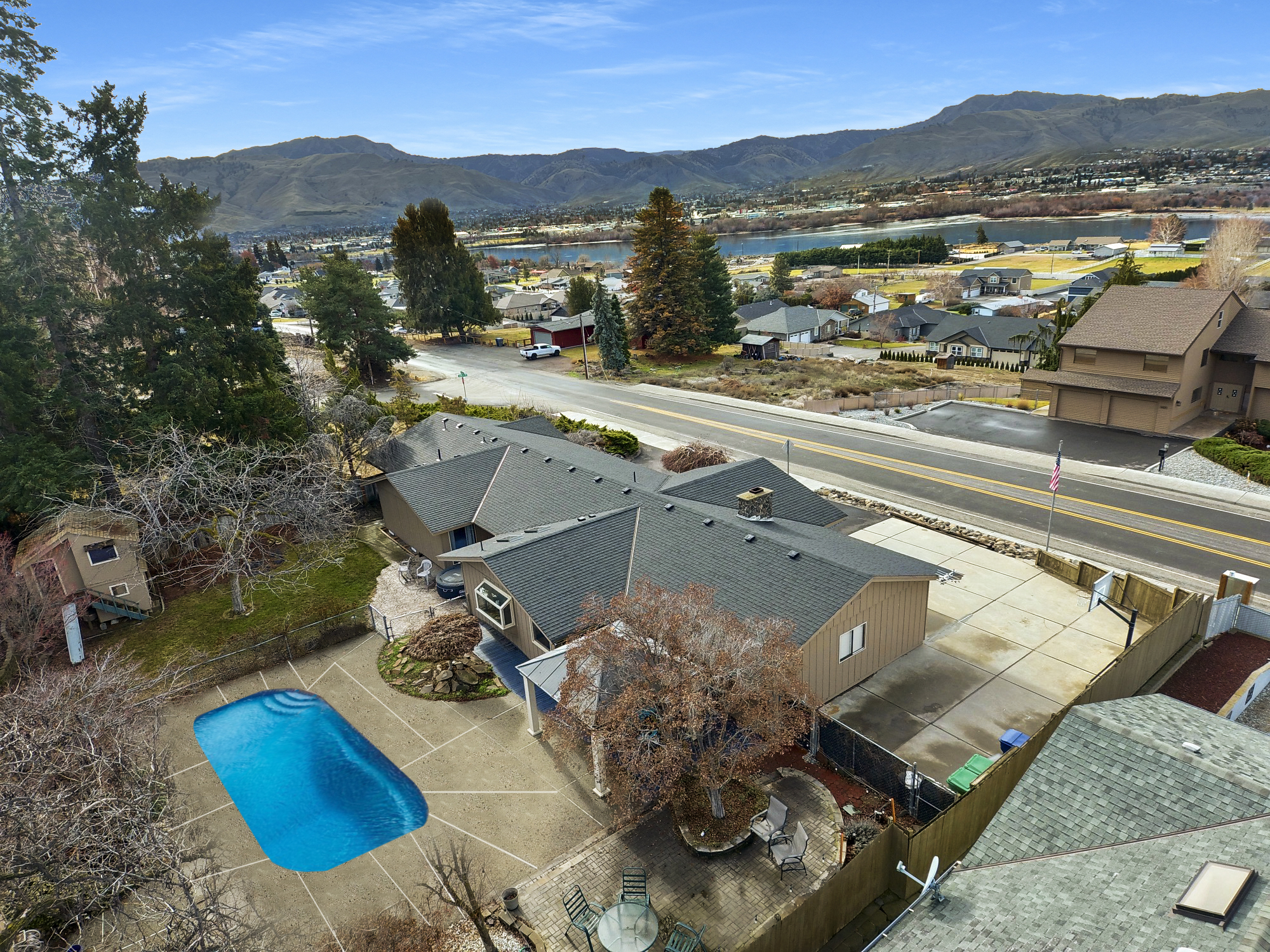 A private backyard with inground swimming pool with access to loop trail.