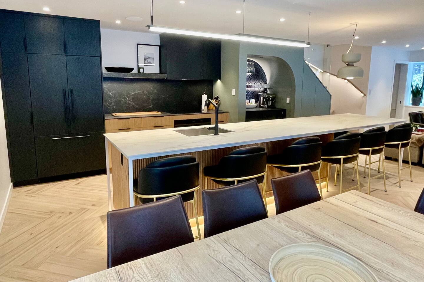 14ft heated island countertop + 4 leaf expandable dining table offers plenty of seating options 