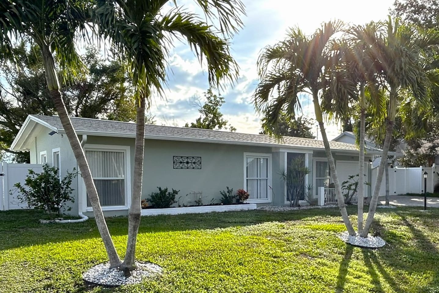 Front of House with Palm Trees

