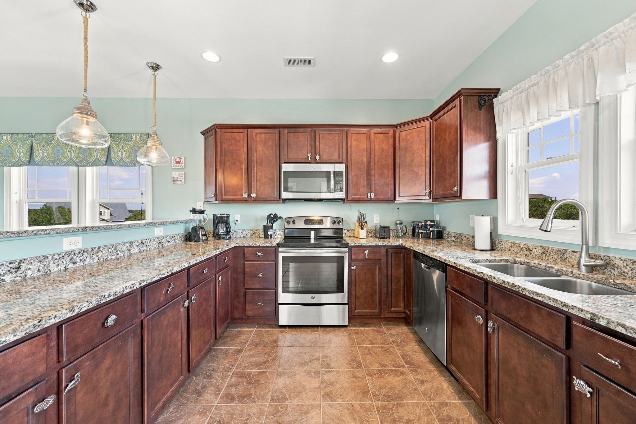 Fully equipped kitchen with blender, toaster, full pot coffee maker, and more