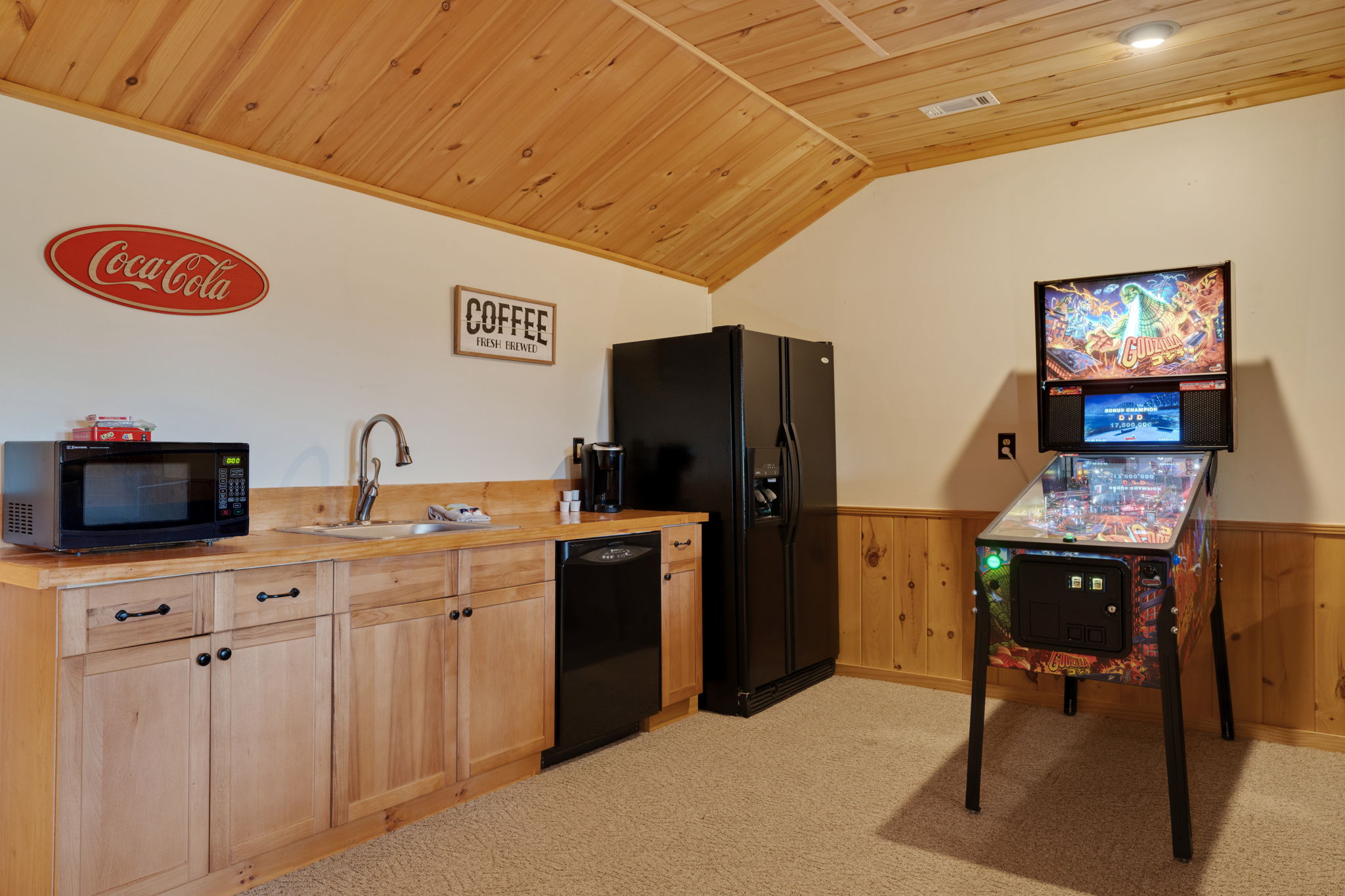 Kitchenette in the basement with full sized Godzilla Pinball game.