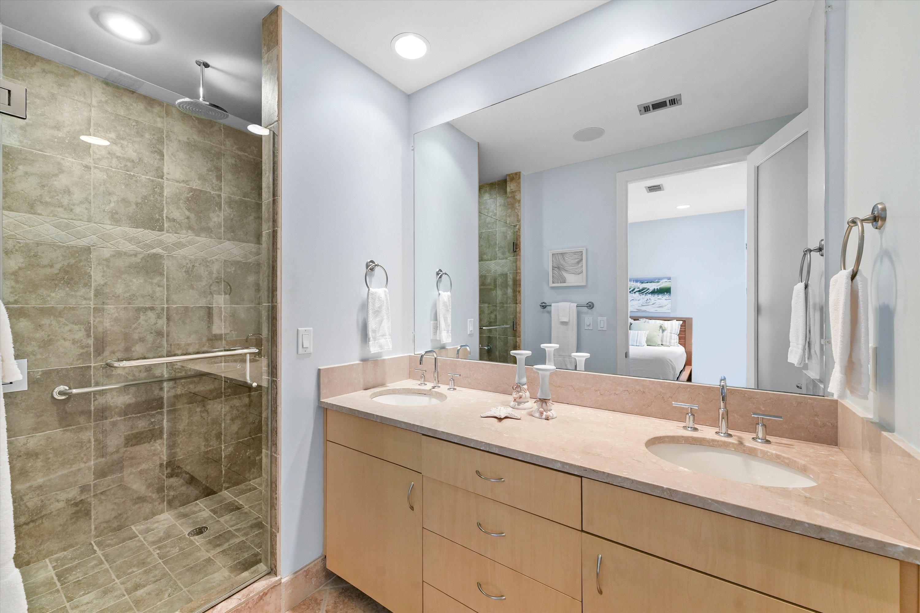 Master bath with dual sinks and walk-in shower with handrails!