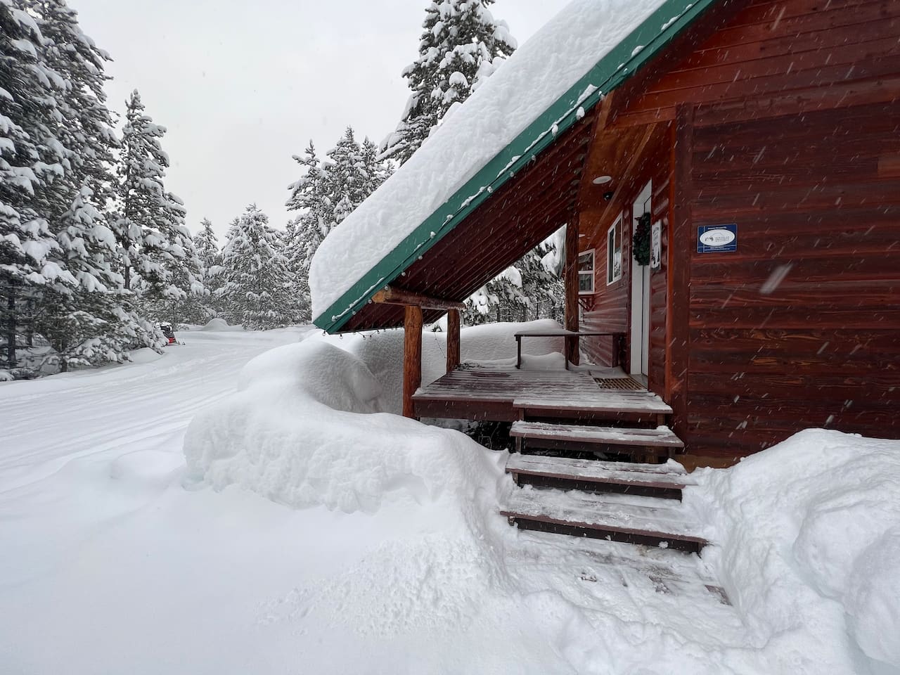 Back entrance - which serves as the main entrance in the winter. Peaceful and beautiful in the winter. Cabin is well heated.