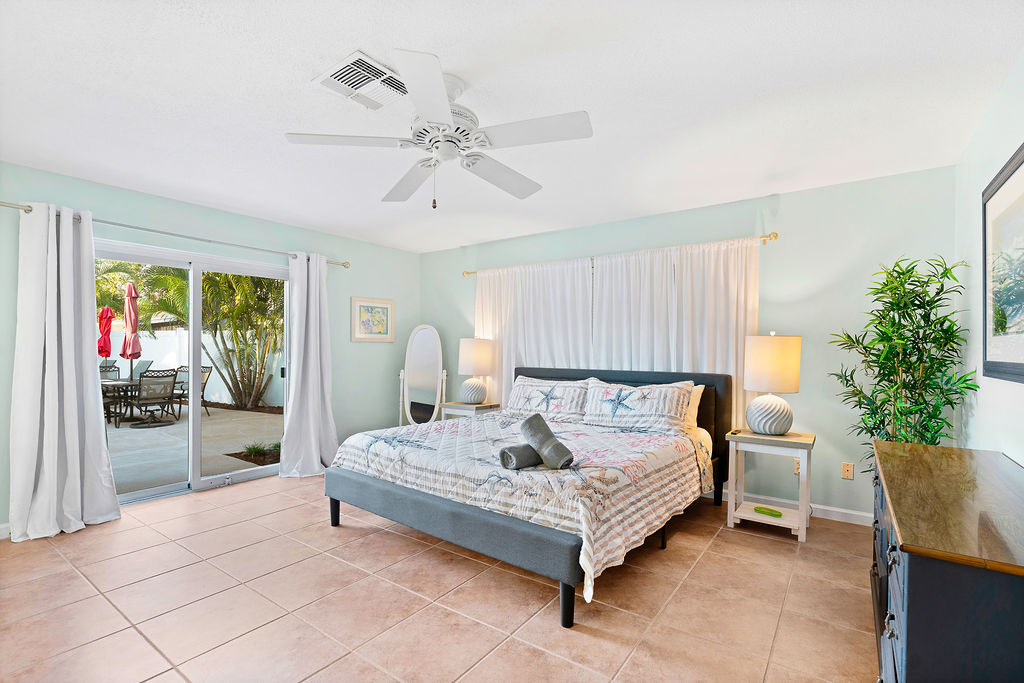The master bedroom overlooks the pool and has an ensuite full bath.