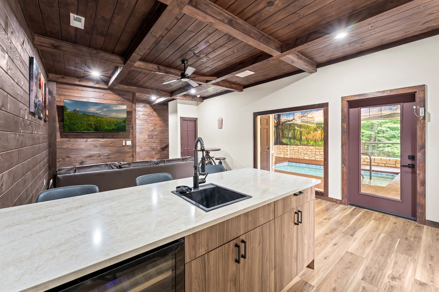 wet bar with an added movie room including an indoor pool view, with a sleeper sofa that sleeps 2

