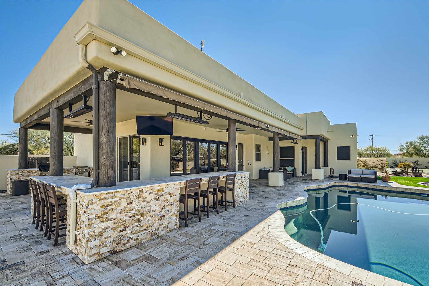 Watch your favorite game from the outdoor bar with awnings and heaters