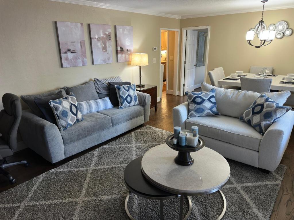 Bright living room w/ plush seating & TV, perfect for relaxing after a day out.