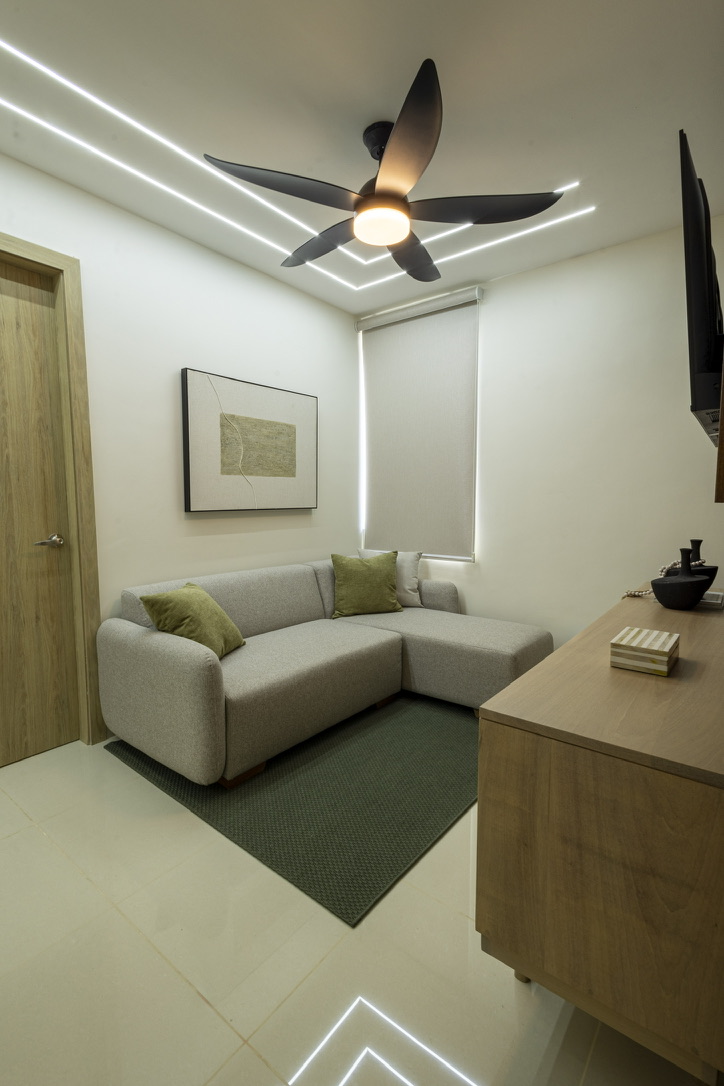 Cozy TV lounge area with a comfy sofa—perfect for movie nights, relaxing, or hooking up your own gaming console. 🎮🍿📺