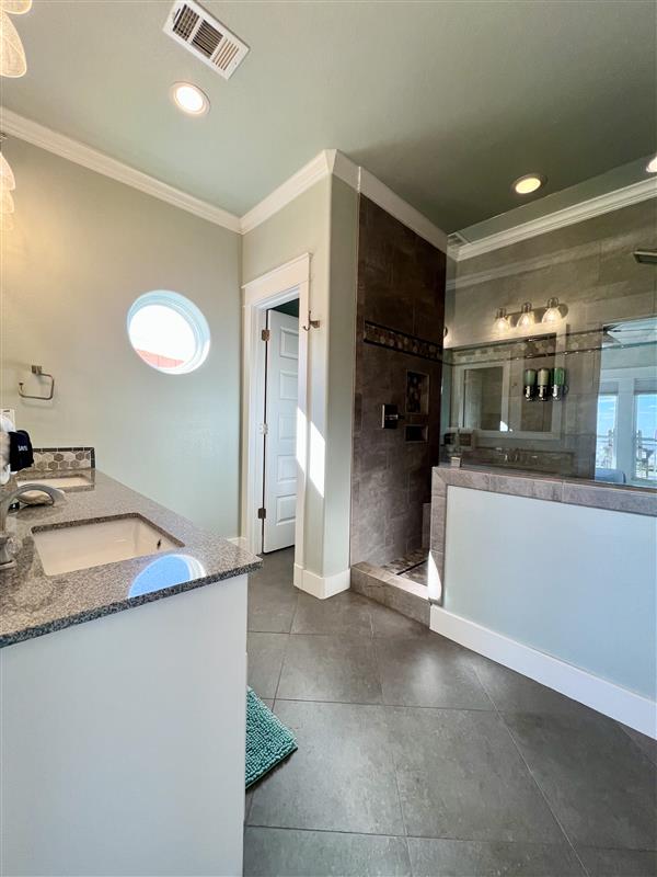 Crystal Paradise Bathroom 4: Our bathrooms include contemporary vanities with quartz countertops, elegant fixtures, and oversized mirrors, offering both function and style.