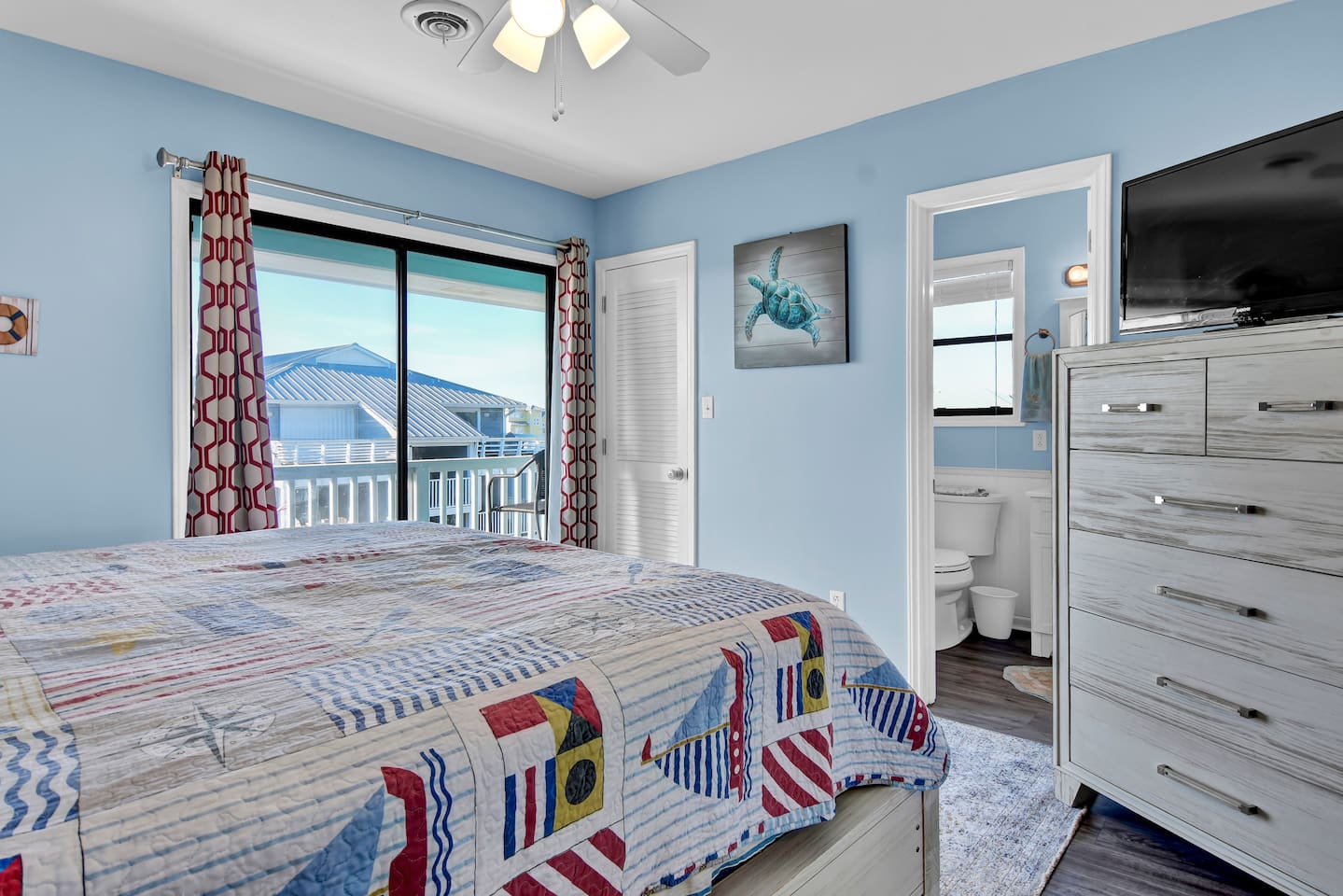 The primary suite offers access to a small, private balcony