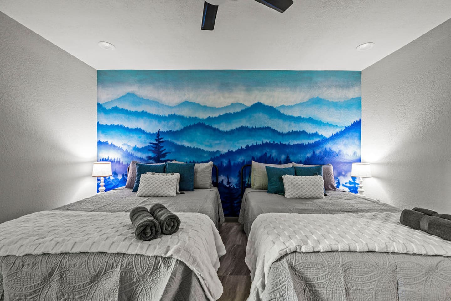 Downstairs bedroom with two queen beds and TV.