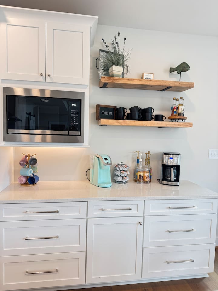 Coffee lovers will love our mini coffee bar in the kitchen. we offer a great selection of specialty coffee syrups as well as a Keurig, pods, coffee, grinder, and regular drip coffee maker.