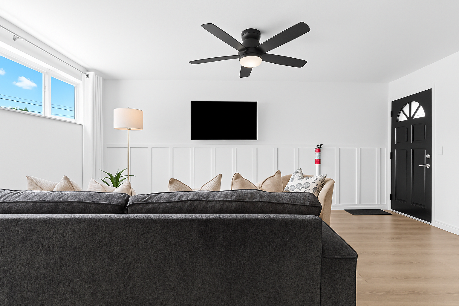 Natural light pours into this inviting space, creating a cheerful ambiance for reading, lounging, or entertaining.