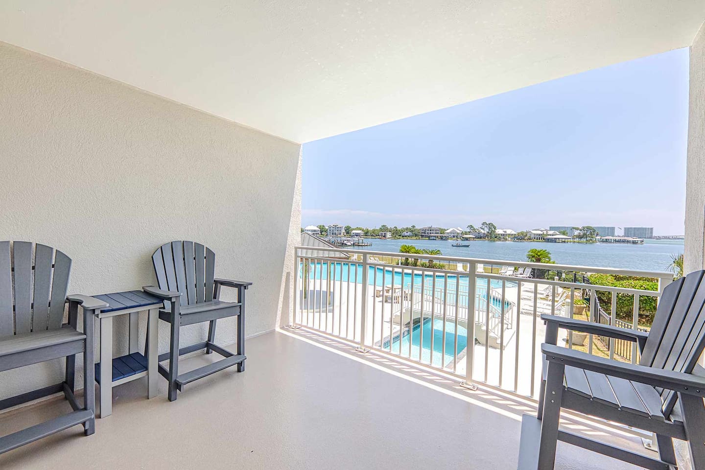 Balcony Retreat: Unwind in style with stunning pool and bay views from your private escape!