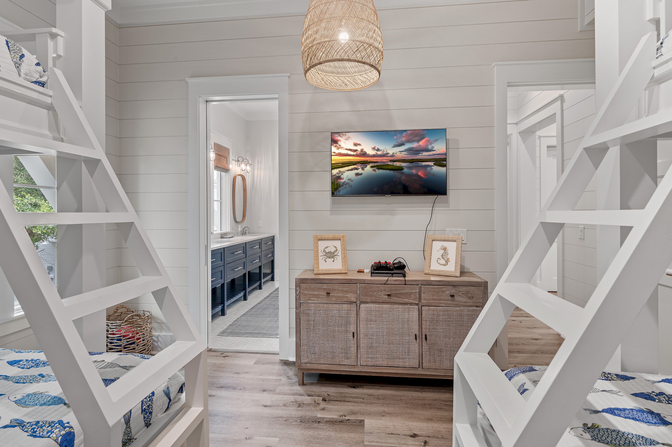 When your kids are worn out from a day in the sun, they can relax in the bunk room with a wall mounted smart TV and gaming console.