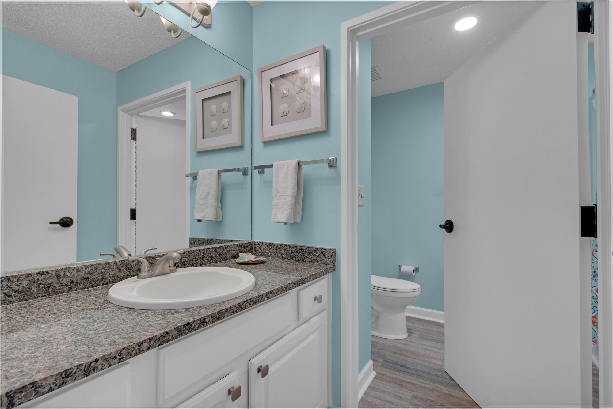 Front bathroom vanity; this bathroom is scheduled for an update in late 2026.