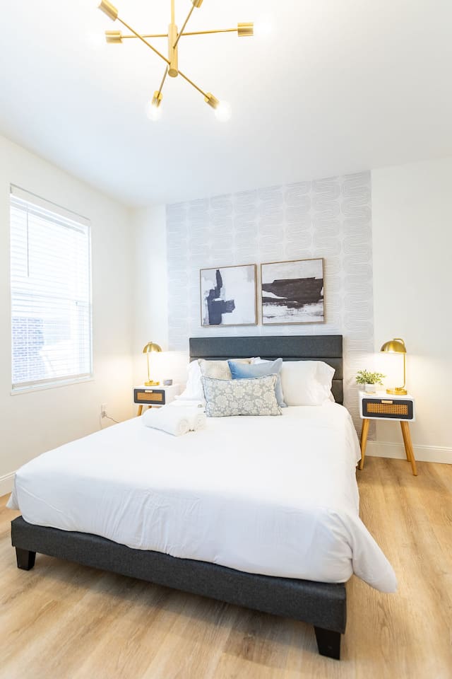 Bright and spacious queen-sized bedroom, offering a comfortable retreat for restful nights.