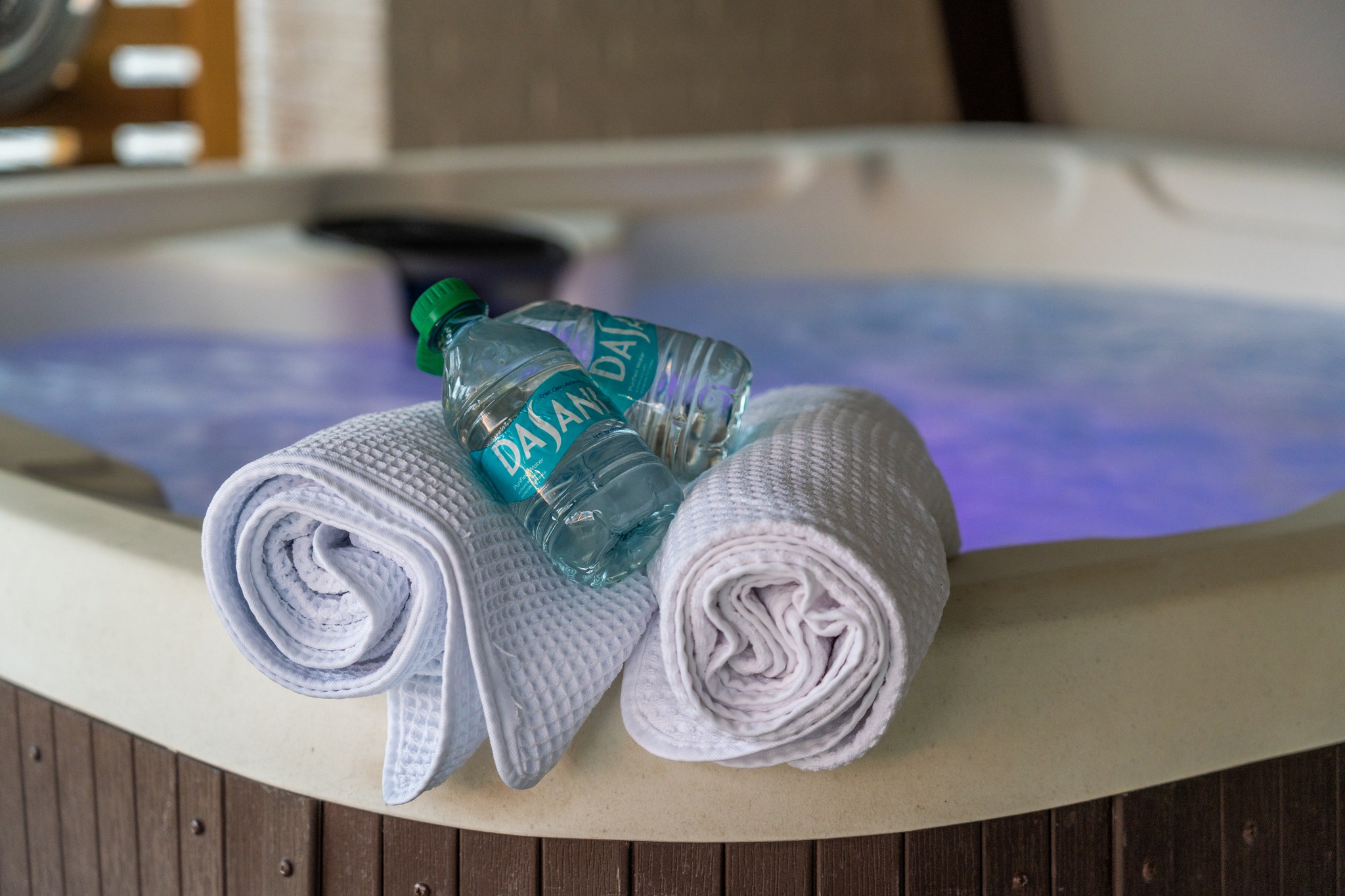 Find the towels rolled and the tub already warm — step out, drop in, and let the day go.