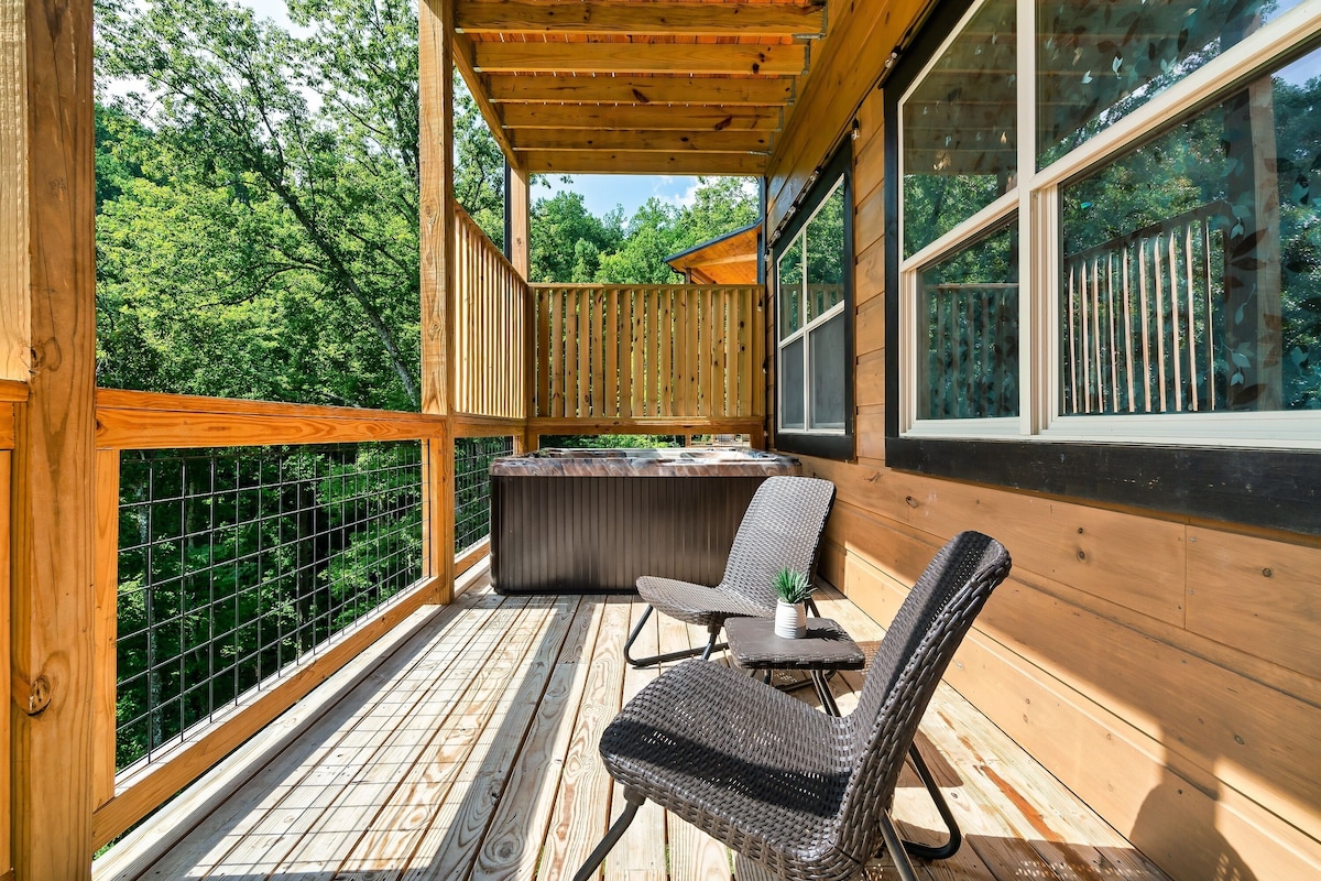 Unwind, relax, and enjoy a drink in the serene bubbles of the hot tub.