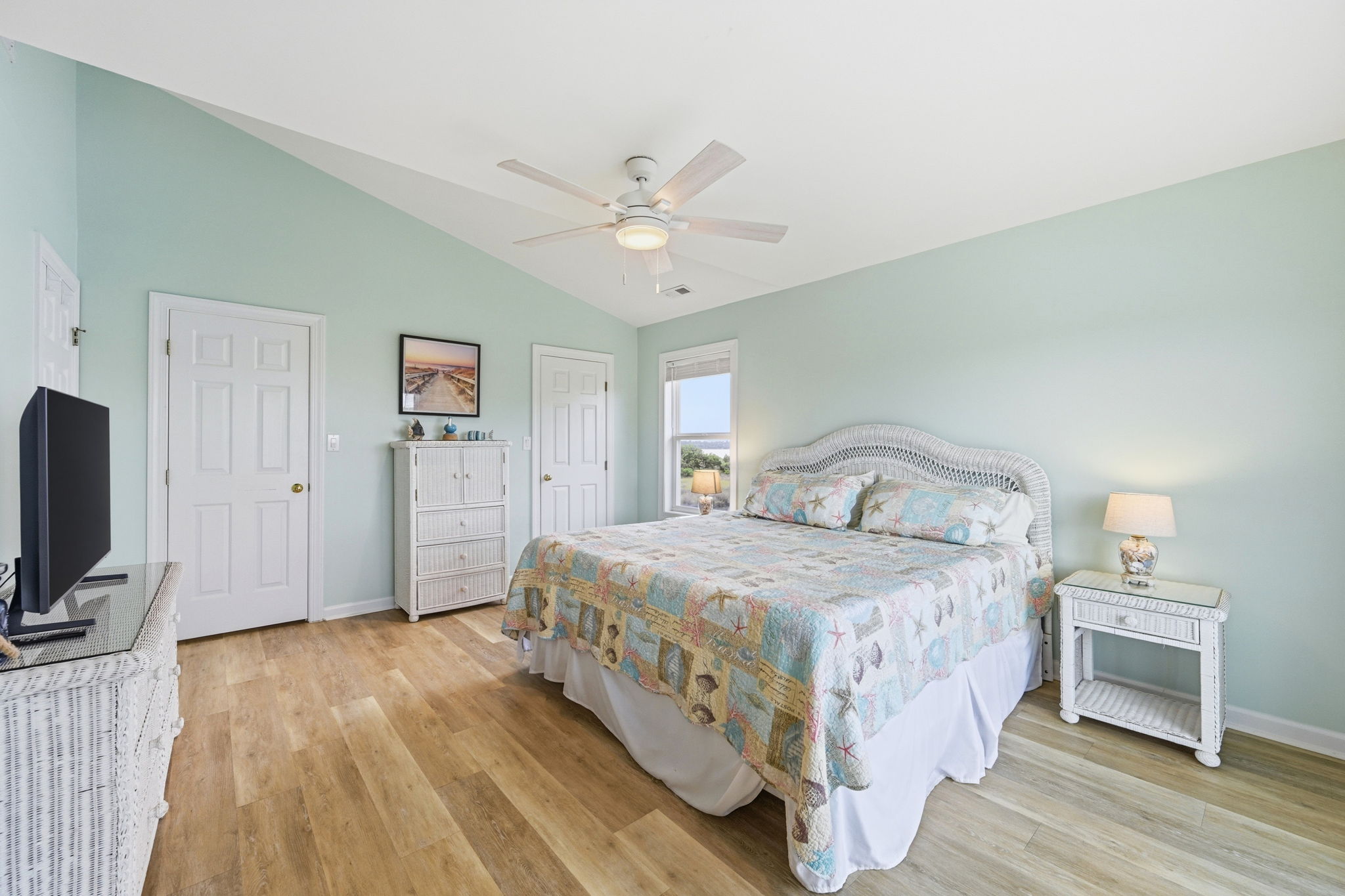 King suite with TV entertainment and generous closet & storage space—designed for a comfortable, clutter-free stay.