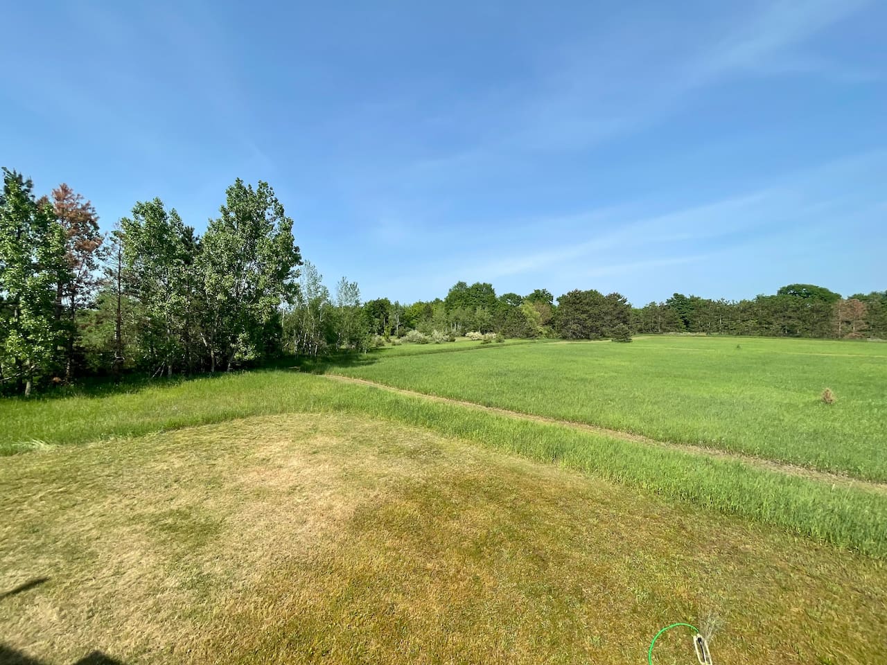 View from balcony overlooking walking path to Twin Lake Park/ Beach access.